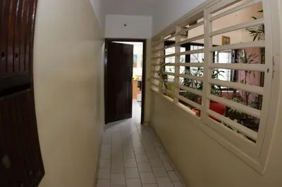 a hallway leading to a room with a window at Apartment Nahda Rabat in Rabat