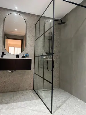 a glass shower in a bathroom with a mirror at Quartier l oasis prêt de la gare in Casablanca