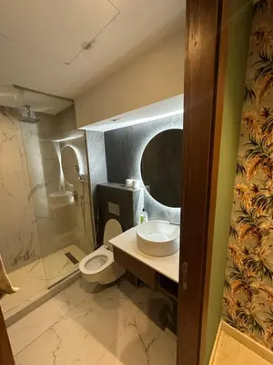 a bathroom with a toilet and a sink and a shower at Signature Leving 119 in Casablanca