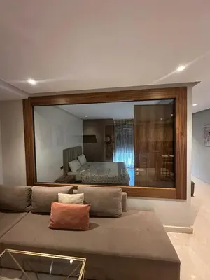 a large mirror on the wall of a bedroom at Signature Leving 119 in Casablanca