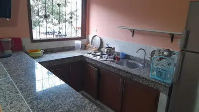 a kitchen counter with a sink and a window at Old school in Rabat