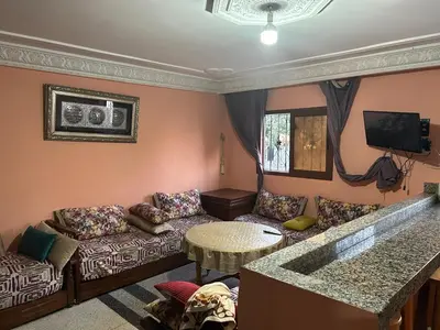 a living room with a couch and a table at Old school in Rabat