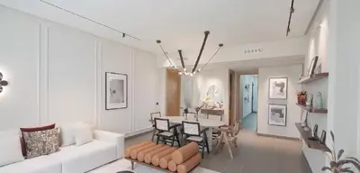 a living room with a white couch and a table at AnfaPlace Residence, Casablanca, la Cornishe-Ain Diab in Casablanca