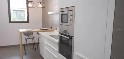a kitchen with a sink and a microwave at AnfaPlace Residence, Casablanca, la Cornishe-Ain Diab in Casablanca