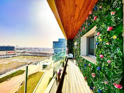 a balcony with flowers on the side of a building at Luxury apartment Marina in Casablanca