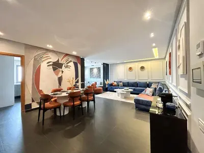 a living room with a couch and a table and chairs at Luxury apartment Marina in Casablanca