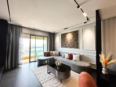 a living room with a couch and a table at Luxury apartment Marina in Casablanca