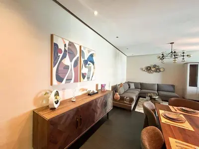 a living room with a couch and a table at 2-bedroom apartment with a breathtaking sea view in Casablanca