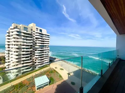 a view of the ocean from a balcony of a building at 2-bedroom apartment with a breathtaking sea view in Casablanca