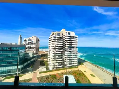 a view of the ocean and some buildings at 2-bedroom apartment with a breathtaking sea view in Casablanca