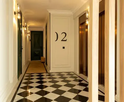 a hallway with a black and white checkered floor at Cozy & Modern Apartment with Rooftop Gym Great Casablanca Location in Casablanca