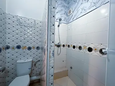 a bathroom with a toilet and a shower at Center Cozy Home in Casablanca