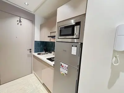 a kitchen with a stainless steel refrigerator with a microwave at Chic & Design Loft À 5 Minutes de la Corniche in Casablanca