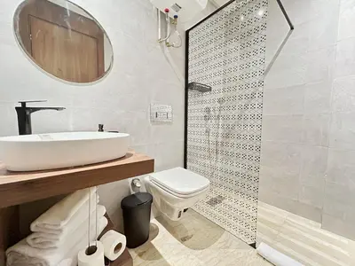 a bathroom with a sink and a toilet and a shower at Chic & Design Loft À 5 Minutes de la Corniche in Casablanca