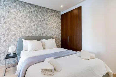 two beds in a bedroom with a wall at Superb apartment Casa Bourgogne - parking in Casablanca