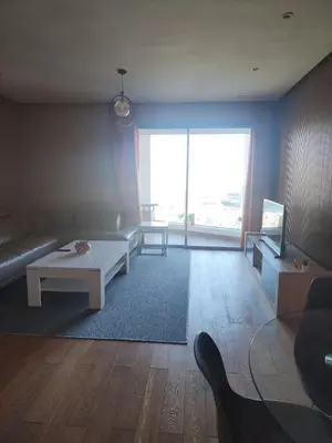a living room with a couch and a table at test chanel in Casablanca