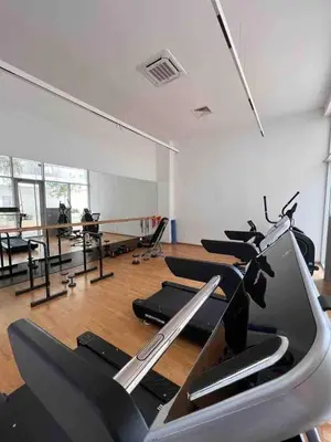 a gym with a bunch of treadmills in a room at HM38 I Spacious & modern close to amenities in Casablanca