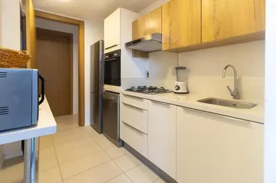a kitchen with white cabinets and a sink at HM38 I Spacious & modern close to amenities in Casablanca