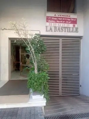 a front door of a building with a tree at Heart of Casablanca - Tramway in Casablanca