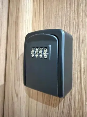 a black electrical switch on a wooden table at Cosy Patio sunny 2BR - new building - near oasis train station in Casablanca