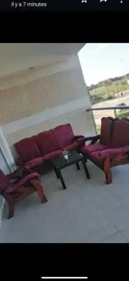 two purple chairs and a table on a balcony at Ola Blanca 2 in Tamaris