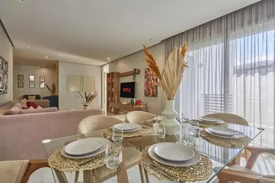 a dining room and living room with a glass table and chairs at Luxury 3 Bedroom Getaway in Bouskouras Finest in Bouskoura