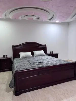a bedroom with a large bed with a ceiling at Appartement à Rabat in Rabat