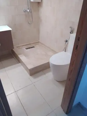 a bathroom with a shower and a toilet in it at vacance à Mansouria P Banus in Mansouria