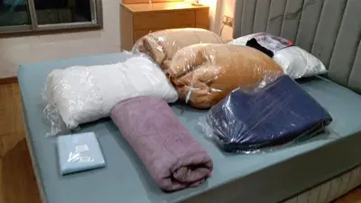 a group of wrapped wrapped towels on a bed at Bel Appartement Confort et Commodités au Cœur de Casablanca Belvédère in Casablanca