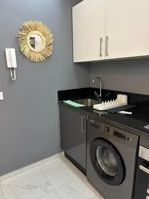 a kitchen with a washing machine and a sink at Sublime Cozy Chic Studio Condo in Downtown Casablanca in Casablanca