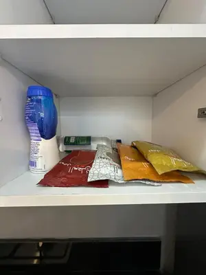 a shelf with towels and a blender on it at Sublime Cozy Chic Studio Condo in Downtown Casablanca in Casablanca
