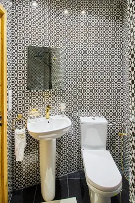 a bathroom with a white toilet and a sink at Luxury Moroccan Studio in Casablanca
