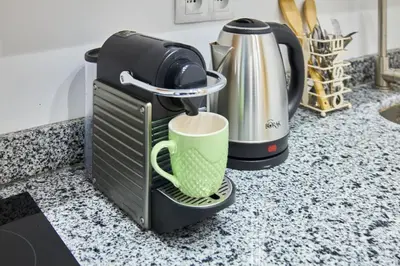 a coffee maker sitting on a counter with a green mug at Luxury Moroccan Studio in Casablanca