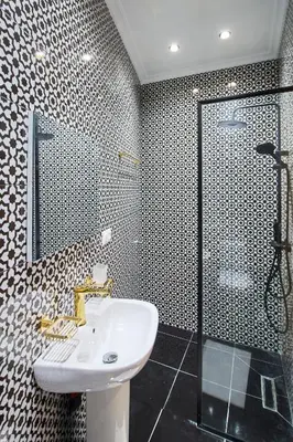 a bathroom with a sink and a shower at Suite DeLuxe au coeur de la ville in Casablanca