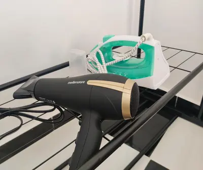 a hair dryer and a bag on a table at Suite DeLuxe au coeur de la ville in Casablanca