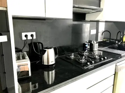a kitchen with a stove with a coffee maker on it at Beautiful Apartment Best View in Casablanca