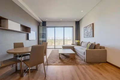 a living room with a couch and a table at Luxury Apartment, Seaview Close Beach in Casablanca