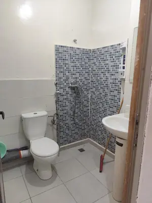 a bathroom with a toilet and a sink at Alia Apartment 25 in Casablanca