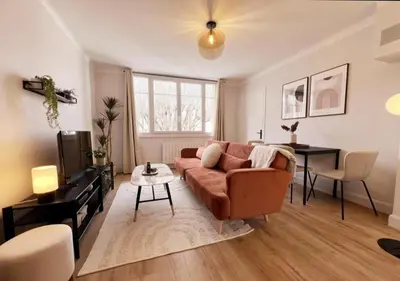 a living room with a couch and a table at Appartement cosyy in Casablanca