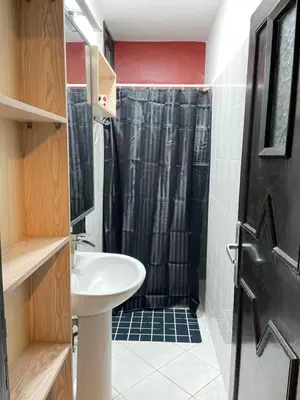 a bathroom with a sink and a shower at Suite des lumières Al Malaki Offre Spéciale front Mer, Zéro Surprise- l'Accueil Aéroport & Service Cuisine si besoin de Tranquillité Totale in Rabat