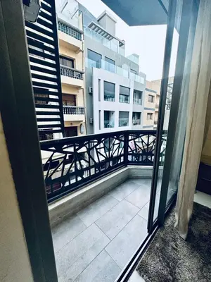 a balcony with a view of a building at Résidence Sheren in Casablanca