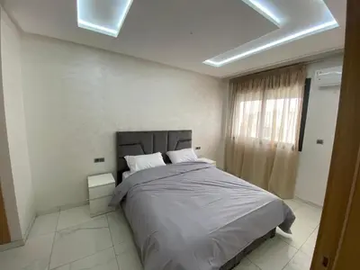 a bedroom with a large bed in a room at Résidence Sheren in Casablanca