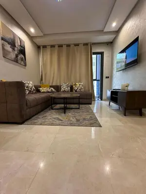 a living room with a couch and a table at Res in Casablanca
