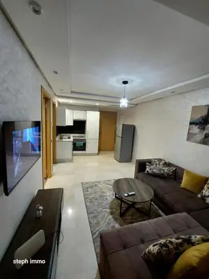 a living room with a couch and a table at Res in Casablanca