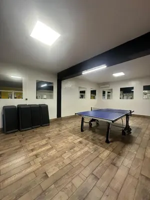an empty room with a ping pong table in it at Luxurious studio with view gym parking and keyless access in Casablanca