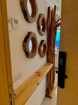 a room with a wall with wooden plates on the wall at Unique apartment in Prestigia Hay Riad Rabat in Rabat