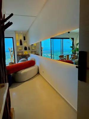 a living room with a view of the ocean at Unique apartment in Prestigia Hay Riad Rabat in Rabat