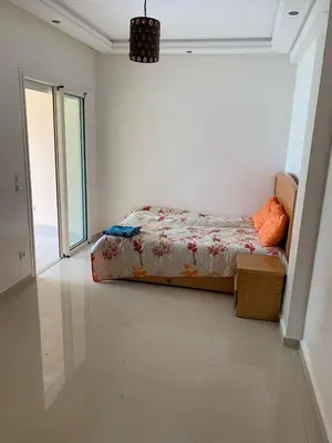 a bedroom with a bed in a white room at ola blanca in Casablanca