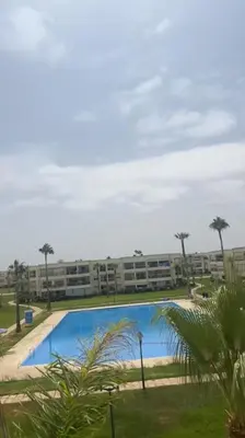 a view of an apartment complex with a large swimming pool at ola blanca in Casablanca