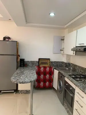 a kitchen with a stove and a counter top at ola blanca in Casablanca